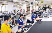 Công nhân may mặc tại Công ty cổ phần may Nhà Bè tại phường Tân Thuận Đông, quận 7.