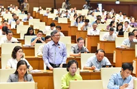 Đại biểu Quốc hội tỉnh Kon Tum phát biểu thảo luận dự thảo Luật Lực lượng tham gia bảo vệ an ninh, trật tự ở cơ sở. (Ảnh THỦY NGUYÊN)