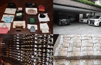 Hàng hóa xa xỉ và tiền mặt bị cảnh sát Singapore thu giữ trong cuộc đột kích. Ảnh: CHANEL NEWS ASIA