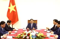 Thủ tướng Chính phủ Phạm Minh Chính điện đàm với Thủ tướng Quốc vụ viện Trung Quốc Lý Cường. (Ảnh: TTXVN)