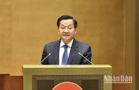 Phó Thủ tướng Chính phủ Lê Minh Khái, thừa ủy quyền của Thủ tướng Chính phủ trình bày báo cáo. (Ảnh: LINH KHOA)