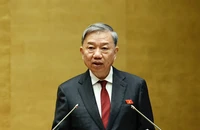 Đại tướng Tô Lâm, Ủy viên Bộ Chính trị, Bộ trưởng Công an trình bày Tờ trình về dự án Luật sửa đổi, bổ sung một số điều của Luật Cảnh vệ. (ẢNH: LINH KHOA)