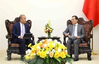 Phó Thủ tướng Trần Lưu Quang tiếp Giám đốc điều hành Văn phòng nhóm Ngân hàng Thế giới phụ trách khu vực Đông Nam Á Wempi Saputra. (Ảnh: An Đăng/TTXVN) 