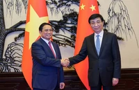 Thủ tướng Phạm Minh Chính và Chủ tịch Chính hiệp toàn quốc Trung Quốc Vương Hộ Ninh.
