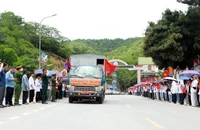 Lễ đón hài cốt liệt sĩ quân tình nguyện, chuyên gia Việt Nam hy sinh tại Lào tại thị trấn Mường Xén.