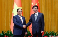 Thủ tướng Phạm Minh Chính hội kiến Chủ tịch Chính hiệp Trung Quốc Vương Hộ Ninh. (Ảnh: Nhật Bắc)