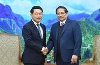 Thủ tướng Phạm Minh Chính và Phó Thủ tướng Lào Saleumxay Kommasith. (Ảnh: TRẦN HẢI)