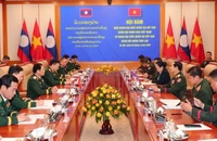 Đoàn đại biểu quân sự cấp cao Quân đội nhân dân Việt Nam do Đại tướng Nguyễn Tân Cương dẫn đầu hội đàm với Đoàn đại biểu quân sự cấp cao Quân đội nhân dân Lào do Trung tướng Saichay Kommasith dẫn đầu.