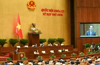 Quốc hội nghe Tờ trình và Báo cáo thẩm tra dự án Luật sửa đổi, bổ sung một số điều của Luật Xử lý vi phạm hành chính. (Ảnh: BÙI GIANG)