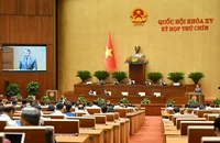 Quốc hội họp phiên toàn thể tại hội trường, tiến hành các nội dung nghe Tờ trình và Báo cáo thẩm tra dự án Luật sửa đổi, bổ sung một số điều của Luật Quốc tịch Việt Nam. (Ảnh: THỦY NGUYÊN)