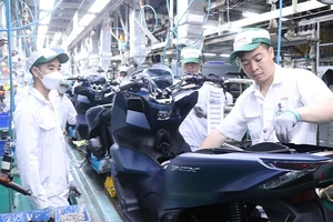Người lao động làm việc tại Công ty Honda Việt Nam. (Ảnh MINH THẮNG)