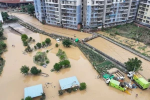 Cảnh ngập lụt sau những trận mưa lớn tại Trùng Khánh, Trung Quốc, ngày 11/7/2024. (Ảnh: THX/TTXVN)