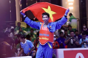 Nguyễn Thanh Liêm sau khi thắng áp đảo đối thủ Emmanuel Dailay Cantores (Philippines) ở chung kết. (Ảnh: Hoàng Linh/TTXVN)