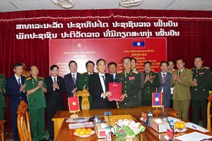 Quang cảnh lễ ký kết phối hợp tìm kiếm, quy tập liệt sĩ.