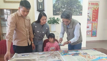 Bạn đọc trên vùng đất Nam Tây Nguyên hào hứng với phụ san đặc biệt của Báo Nhân Dân .