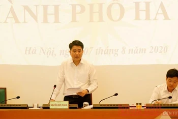 Chủ tịch UBND thành phố Hà Nội Nguyễn Đức Chung báo cáo tại cuộc họp trực tuyến (ẢNH: MINH NGỌC)