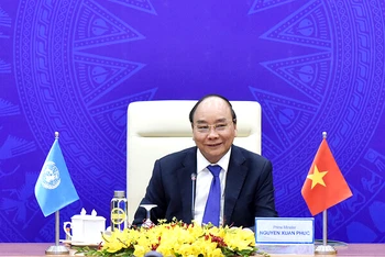 Thủ tướng Nguyễn Xuân Phúc phát biểu tại điểm cầu Hà Nội. Ảnh: TRẦN HẢI 