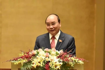 Thủ tướng Chính phủ Nguyễn Xuân Phúc trình bày Báo cáo Công tác nhiệm kỳ 2016-2021 của Chính phủ, sáng 24-3 (Ảnh: TRẦN HẢI)