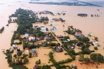 Nước lũ dâng cao ở Quảng Bình trong đợt mưa lũ nghiêm trọng ở miền trung tháng 10-2020 (Ảnh minh họa: Hương Giang).