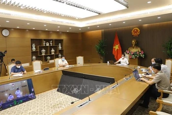 Phó Thủ tướng Vũ Đức Đam họp với tỉnh Bắc Giang về công tác phòng, chống dịch Covid-19. (Ảnh: TTXVN)