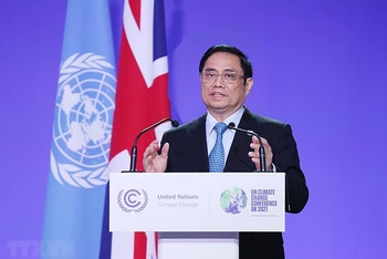 Thủ tướng Phạm Minh Chính phát biểu tại Hội nghị lần thứ 26 các bên tham gia Công ước khung của Liên hợp quốc về biến đổi khí hậu (COP26). (Ảnh: Dương Giang/TTXVN)