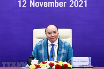 Chủ tịch nước Nguyễn Xuân Phúc tại điểm cầu Hà Nội. (Ảnh: TTXVN)