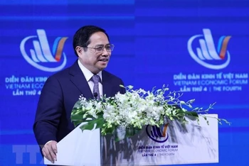 Thủ tướng Phạm Minh Chính phát biểu tại Diễn đàn Kinh tế Việt Nam lần thứ tư. (Ảnh: Dương Giang/TTXVN)