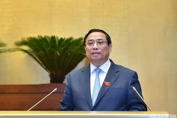 Thủ tướng Phạm Minh Chính trình bày báo cáo giải trình và trả lời chất vấn của Chính phủ tại Kỳ họp thứ 6, Quốc hội khóa XV. (Ảnh: ĐĂNG KHOA)