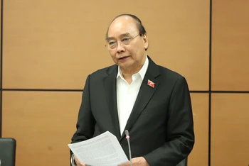 Chủ tịch nước Nguyễn Xuân Phúc góp ý kiến vào dự thảo Quy hoạch tổng thể quốc gia trong phiên thảo luận ở tổ, sáng 6/1.