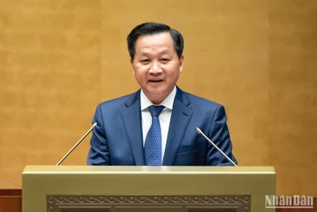 Phó Thủ tướng Lê Minh Khái báo cáo tại Hội nghị toàn quốc triển khai luật, nghị quyết của Quốc hội khóa XV. (Ảnh: DUY LINH)