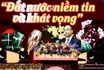 Chủ tịch nước Nguyễn Xuân Phúc phát biểu, chúc Tết bà con kiều bào. (Ảnh: TTXVN) 