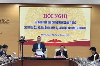 Phó Thống đốc Thường trực Ngân hàng Nhà nước Đào Minh Tú cùng Thứ trưởng Bộ Xây dựng Nguyễn Văn Sinh chủ trì Hội nghị.