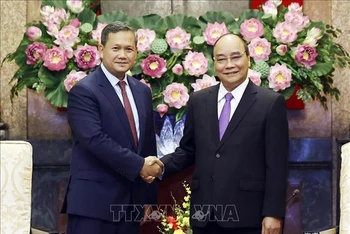 Chủ tịch nước Nguyễn Xuân Phúc đã tiếp Đại tướng Hun Manet, Phó Tổng tư lệnh kiêm Tư lệnh Lục quân Quân đội Hoàng gia Campuchia. (Ảnh: Thống Nhất/TTXVN) 