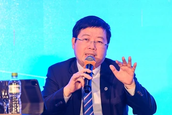 Ông Nguyễn Thanh Lâm, Thứ trưởng Bộ Thông tin và Truyền thông trao đổi tại hội thảo.
