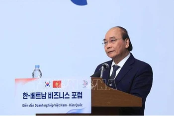 Chủ tịch nước Nguyễn Xuân Phúc phát biểu tại diễn đàn. (Ảnh: Thống Nhất/ TTXVN)