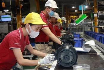 Sản xuất động cơ điện tại một doanh nghiệp ở Khu công nghiệp Amata (Đồng Nai). (Ảnh: LÂM BÌNH và TÂN VƯƠNG)