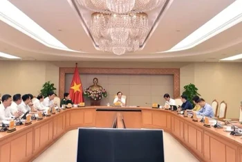 Phó Thủ tướng Trần Lưu Quang chủ trì cuộc họp về dự thảo Quy hoạch phát triển mạng lưới cơ sở báo chí, phát thanh truyền hình, thông tin điện tử, cơ sở xuất bản thời kỳ 2021-2030, tầm nhìn đến năm 2050. (Ảnh: VGP)
