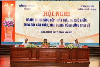 Lãnh đạo Thành ủy Thành phố Hồ Chí Minh cùng Ngân hàng Nhà nước Việt Nam đồng chủ trì hội nghị. (Ảnh: Ngân hàng Nhà nước Việt Nam)