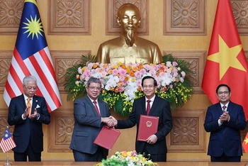 Trao đổi “Bản ghi nhớ về tuyển dụng, việc làm và hồi hương lao động giữa Chính phủ nước CHXHCN Việt Nam và Chính phủ Malaysia” ngày 21/3/2022. (Ảnh: Molisa)