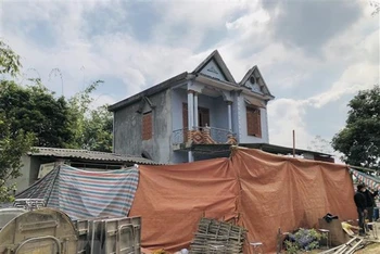 Ngôi nhà tại thôn Tân Lập xã Trung Hòa, huyện Chiêm Hóa, tỉnh Tuyên Quang, nơi xảy ra vụ việc thương tâm. (Ảnh: TTXVN)