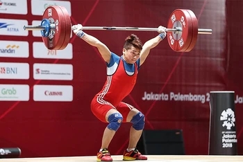 Vận động viên cử tạ Trịnh Văn Vinh được kỳ vọng giành huy chương tại Olympic Paris 2024. (Ảnh DT)