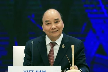 Chủ tịch nước Nguyễn Xuân Phúc khẳng định Việt Nam ủng hộ hệ thống thương mại đa phương dựa trên nguyên tắc và luật lệ, với WTO là trung tâm. (Ảnh: TTXVN) 