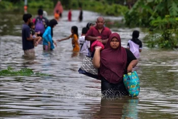 Cảnh ngập lụt sau những trận mưa lớn. (Ảnh: AFP/TTXVN)