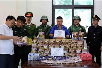 Đối tượng Lê Hữu Lam cùng tang vật bị lực lượng chức năng bắt giữ.