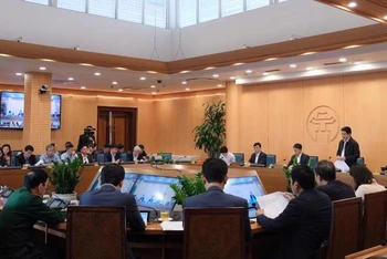Các đại biểu tham dự hội nghị tại điểm cầu Trụ sở Ủy ban nhân dân thành phố. 