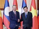Chủ tịch nước Tô Lâm và Tổng Bí thư, Chủ tịch nước Lào Thongloun Sisoulith chụp ảnh chung. (Ảnh: NHAN SÁNG /TTXVN)
