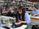 Công nhân Công ty Ladoda may túi, cặp da phục vụ thị trường trong nước và xuất khẩu. (Ảnh: TRẦN HẢI)