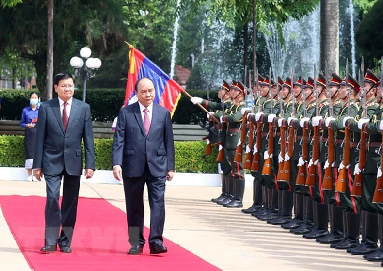 Tổng Bí thư, Chủ tịch nước Lào đón, hội đàm với Chủ tịch nước Nguyễn Xuân Phúc -0