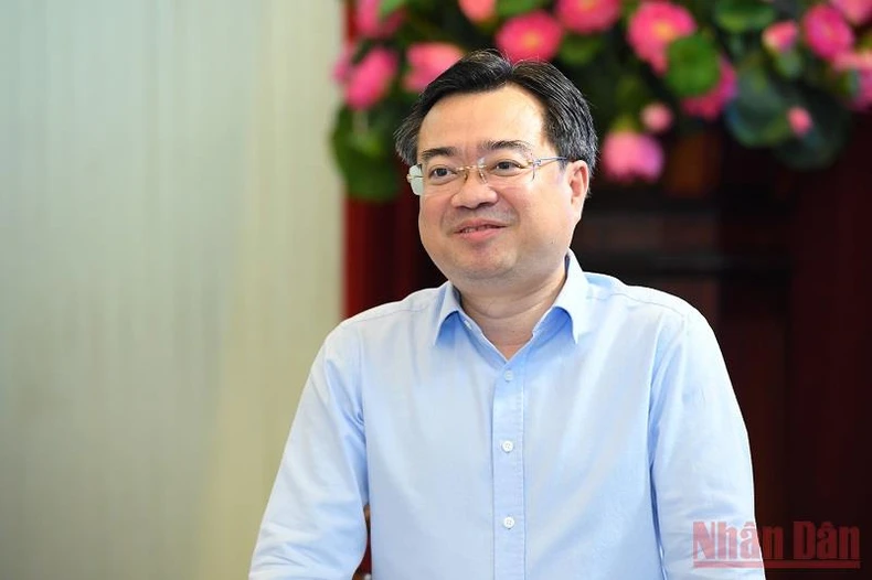 Tăng cường hợp tác thông tin tuyên truyền giữa Báo Nhân Dân và Bộ Xây dựng -0