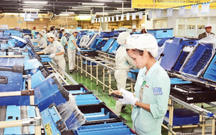 Hiện đã có 97 quốc gia và vùng lãnh thổ tham gia đầu tư vào Hà Nội. Trong ảnh: Sản xuất linh kiện điện tử tại Công ty Canon Việt Nam, Khu công nghiệp Bắc Thăng Long. Ảnh: NGỌC MAI